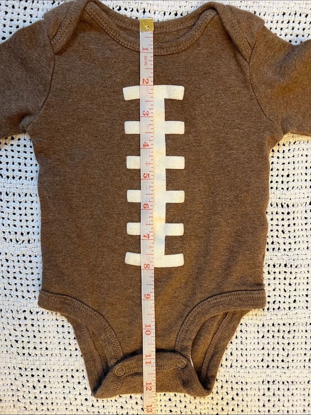 Carter’s | Brown Football-Stitch Long-Sleeve Baby One-Piece Size 3 Months